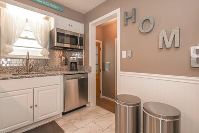 The granite countertops and tile floor are just two of the great features of this kitchen.