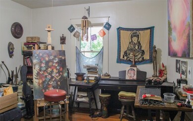 One of the bedrooms, being utilized as an artists'