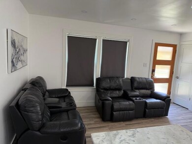 Living area with light wood finished floors