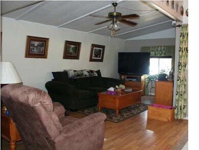 LIVING ROOM IS OPEN TO DINING ROOM WITH BEAUTIFUL 