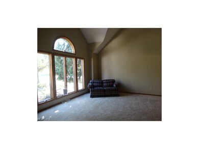Living room with vaulted ceiling and fantastic win