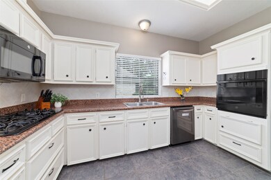 Kitchen has plenty of cabinet space and counter sp