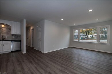 View of Great Room, Kitchen and Hallway to 3 bedrooms.