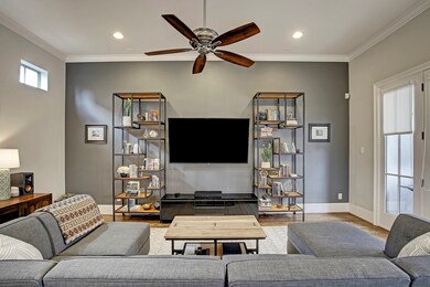 Head-on view of the living room. Hardwood floors t