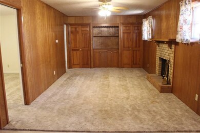 Large family room with built in and storage cabine