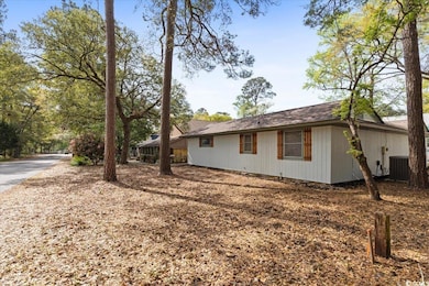 View of side of home with central air condition un