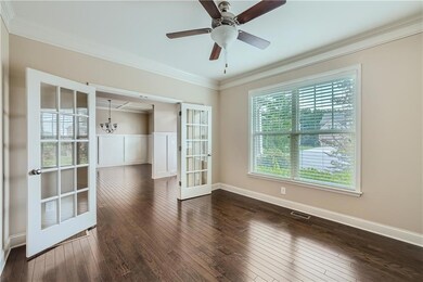 Spare room featuring french doors, dark wood finis