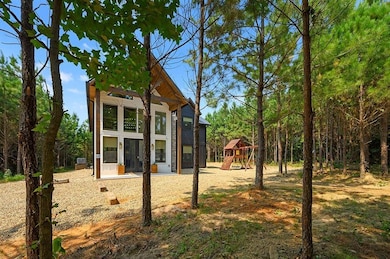 Back of property with a playground