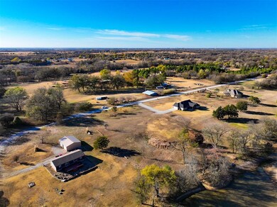 Aerial overview of property's location featuring rural landscape