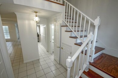 Half bath located in foyer area.