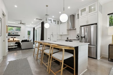 Kitchen with stainless steel refrigerator with ic