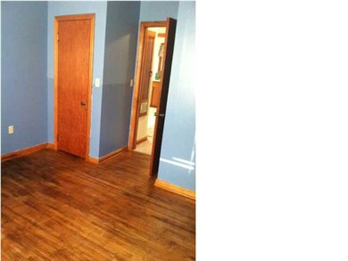 Refinished hardwood floors waiting for your furnit