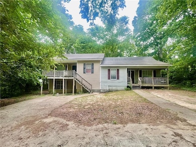 Split level home featuring a porch, driveway, and 