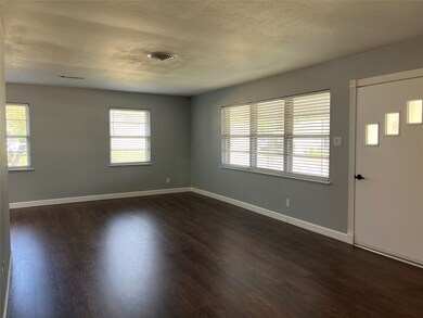 Spacious living area with large windows providing