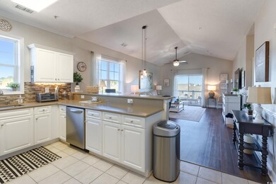 Kitchen featuring lofted ceiling, kitchen peninsul