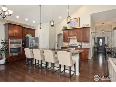 Come Inside! Enjoy the Large Gourmet Kitchen with Pendant Lighting, Vaulted Ceilings, Large Granite Island & Plenty of Cabinet Space!