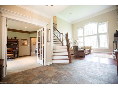 The foyer opens to the formal living room, used cu