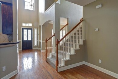 The Two-Story Foyer is Accented with Beautiful Mol