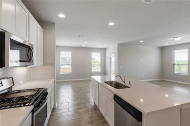 Kitchen featuring appliances with stainless steel