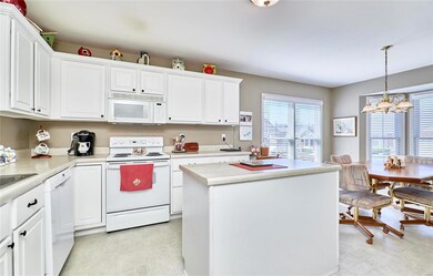Center Island and custom cabinetry. 12 X 10.