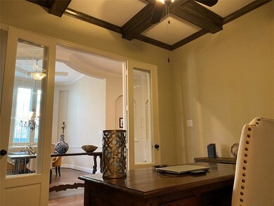 Home office with custom wood beams large walk in closet under stairs