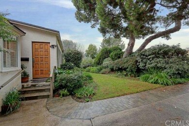 Gorgeous landscaped walkway up the front steps to 
