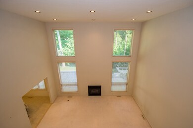 Soaring ceilings with floor to ceiling windows.  G