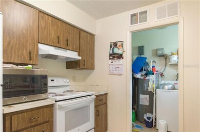 Unit A kitchen with view to laundry/utility room t