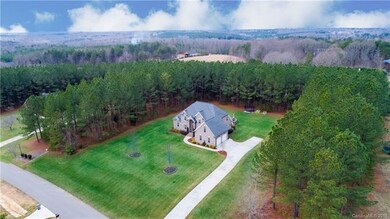 2.6 acres! Home is centrally situated in a clearin