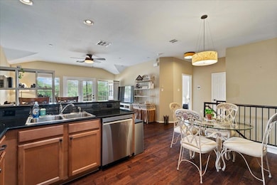 Kitchen featuring stainless steel dishwasher, a s