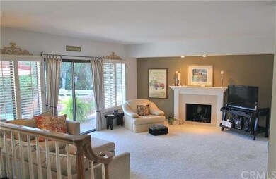 Spacious family room with custom fireplace opens t