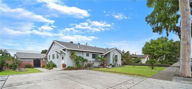 Charming Home with 2 Separate 1 Bedroom Suites in Back with Private Entrances. This Home has a Permitted Extra Wide Driveway with Stamped Concrete. Can Park 4+ Homes. Detached Garage in Back with Alley Access and Huge Yard with Covered Patio.