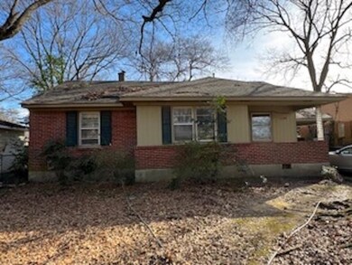 View of front of property with a carport
