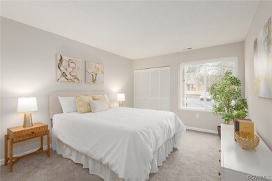 Bedroom featuring a closet and light carpet