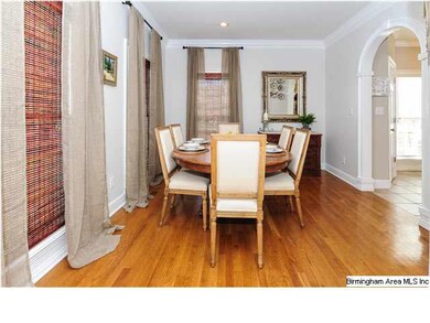 Formal Dining room has crown molding, hardwood flo