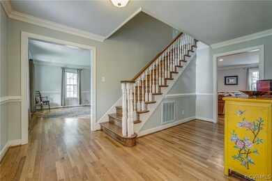 Staircase with crown molding and hardwood / wood-s