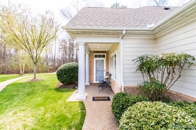 Front porch overlooks walking path to bridge