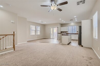 Unfurnished living room with light colored carpet,