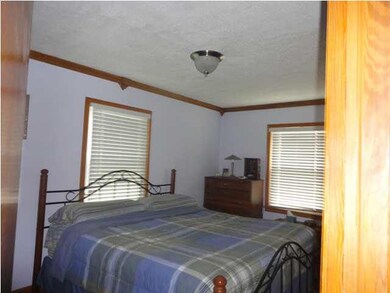 Master bedroom is neutral and large enough for a k