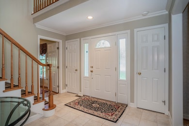 Looking back at the front door and twin front closets