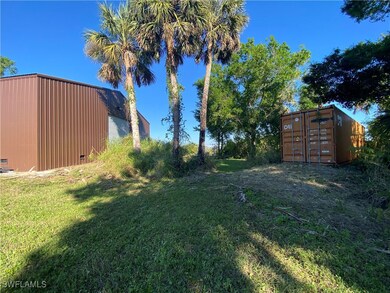 View of yard featuring mail area and an outbuildin