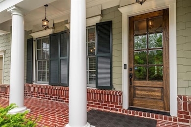 Cozy front porch overlooks cul de sac