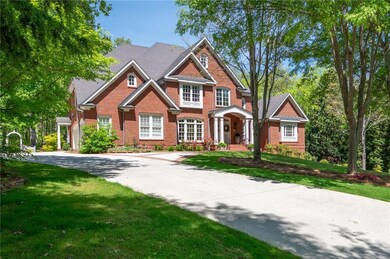 This beautiful brick estate features a long, sweep