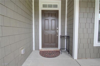 FRONT DOOR: The elegant front door recessed from t