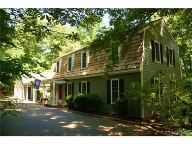 Side entrance showing breezway to 2 car garage