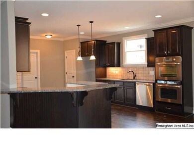 Kitchen with granite countertops. Island and penis