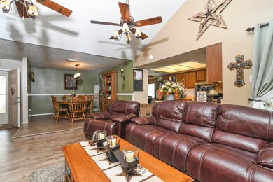 Open living room into the dining room. Note the ra