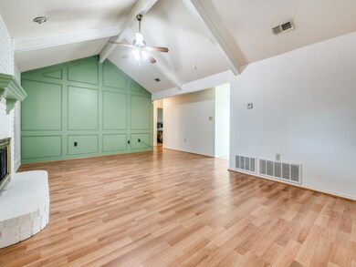 Unfurnished living room featuring visible vents, c