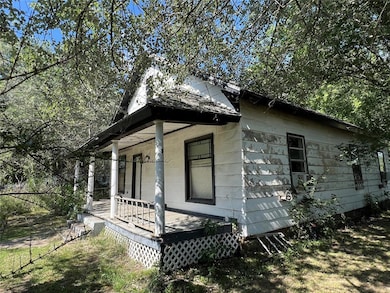 View of side of property featuring a porch