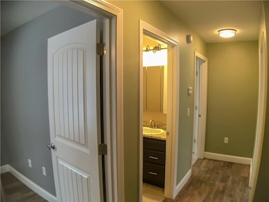 Upstairs hallway with three...